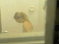 Blonde in window caught stripping and washing