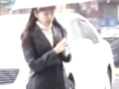 Rainy street sharking scene of some truly glamorous Japanese chick
