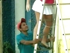 Candid camera voyeur presents cute girl with a round bum on the ladder.
