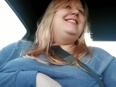 Girl plays with boobs while driving around