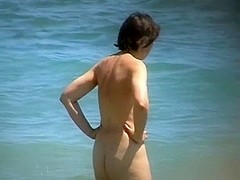 Nude mature takes a nice swim