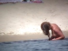 Sweet naked philander chilling on the nudist beach