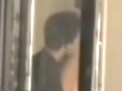 Man kissing the naked lover on window voyeur movie