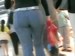Hot brunette w/ a nice ass in a voyur porno pacing in a shopping mall