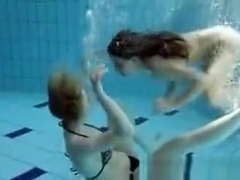 Zuzanna and Lucie playing underwater