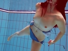 Redhead In Blue Bikini Showing Her Body