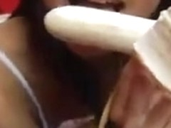 Titless Asian teen plays with a banana