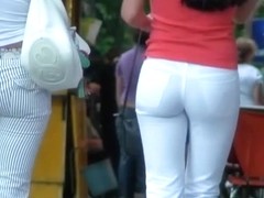 Two ladies with sexy asses walking down the street