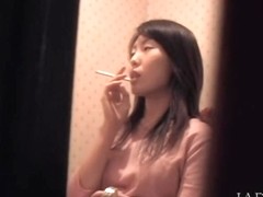 Spy cam caught a spicy Japanese babe masturbating in the toilet