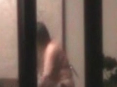Naked woman in window