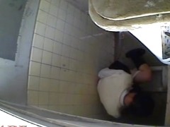A horny Asian chick masturbating in the college toilet