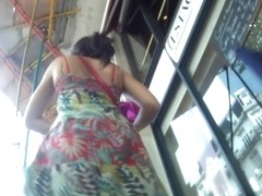 Chubby woman with big butt caught on the upskirt camera
