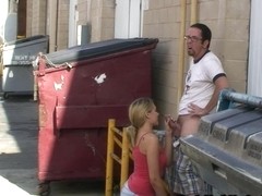 Slim blonde gives marvelous blowjob near the trash can