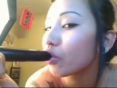 Asian babe and her toys on a webcam show