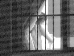 Fem is hiding tits under bra on window voyeur video