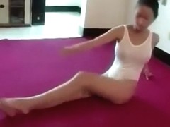 Flexible Asian ballerina stretches out