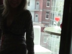 Blonde hottie loves touching herself by the window