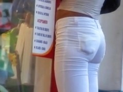 Sexy tanned babe in white jeans caught on camera