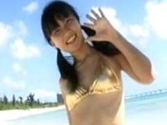 Asian hottie Misuzu posing on a beach