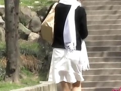 Japanese sharking video showing a gorgeous gal in a skirt