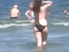 Curvy topless beach gal