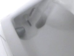 Women's toilet pissing spy cam video starring several ladies