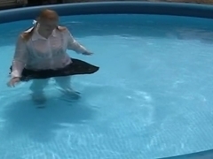 Schoolgirl swimming in pool