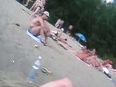 A voracious voyeur loves making videos on the nude beach.
