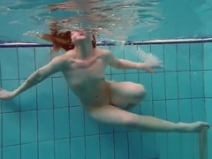 Pierced teen swimming