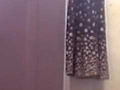 Girl on solo spy cam video dresses after shower