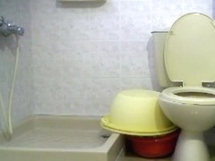 Blonde chick shows her pussy on a hidden toilet camera