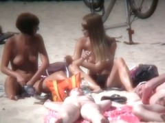 2 white babes with nice big side saggin breasts on a nude beach