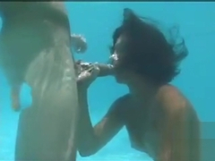 Underwater orgy oral sex