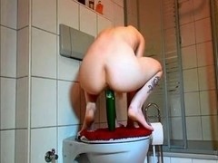 Hawt emo honey masturbates with cucumber in washroom