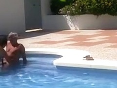Mature couple fucks in the pool on vacation
