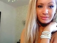 Blonde beauty strips and dances