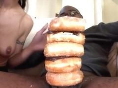 French girls decorates long and powerful black dick with doughnuts