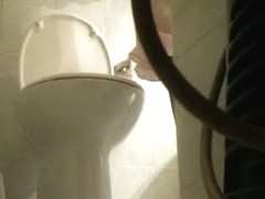 Peeing hidden cam captures babe emptying her bladder on the toilet