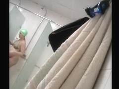 Spy cam on shower wall captured pregnant gadget