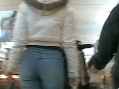 Sexy Latina girl in jeans followed by voyeur