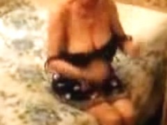 Naughty granny stripping her hot body and exposing her big juggs