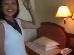 Asian girl has sex with an asian guy, while a friend tapes it.