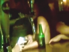 Dark haired russian girl dances naked in a bar