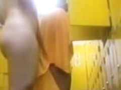 Asian bimbo toweling herself after shower in change room