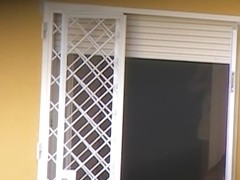 Nasty neighbor films somebody through the window