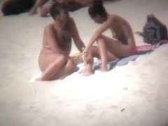 Hot naked babes revealing their nice tits on the beach